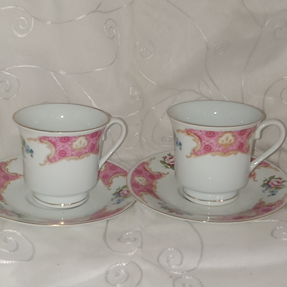 Two Beautiful Dainty Cups And Saucers